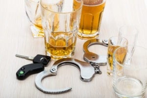 alcohol, keys, and handcuffs