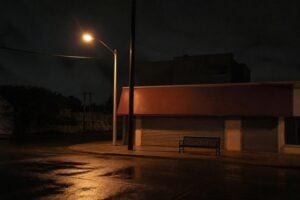 Empty street corner under a streetlight at night